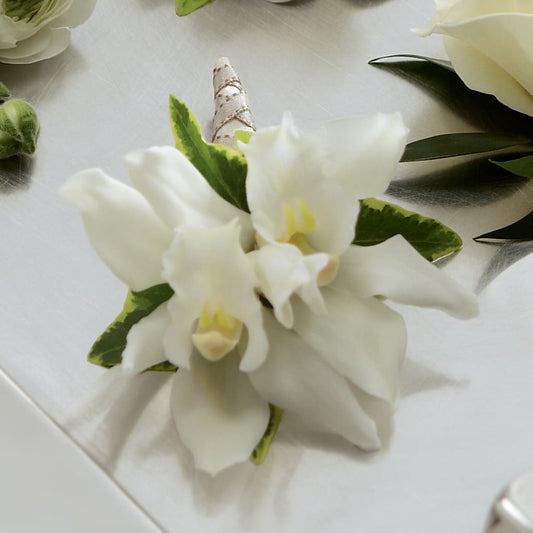 White Mini Cymbidium Boutonniere – CARLOS BLOOMS & EVENTS, Garnerville NY
